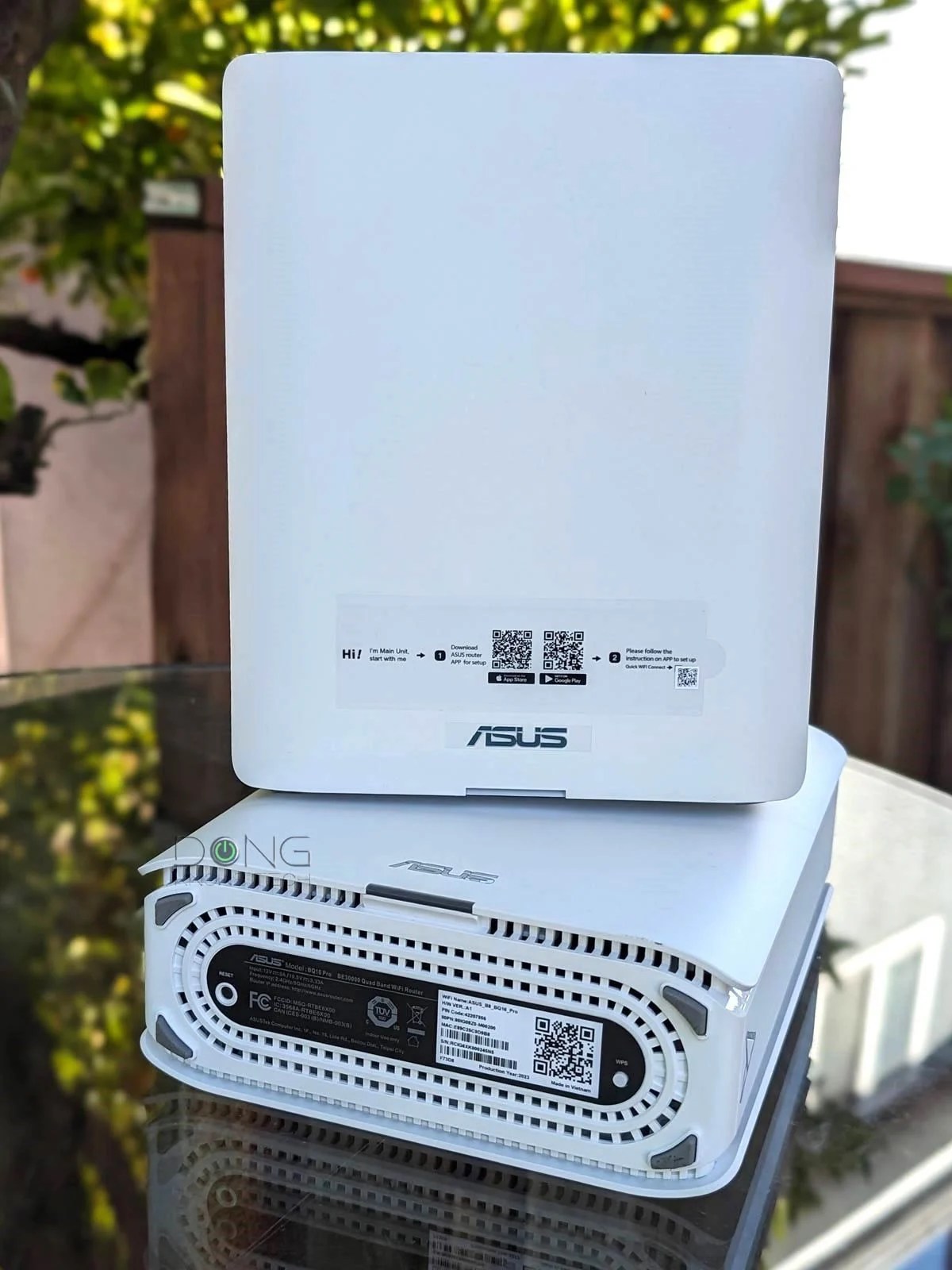 A 2 pack Asus ZenWiFi BQ16 Pro Mesh system includes tow identical routers but one is labeled as the main unit