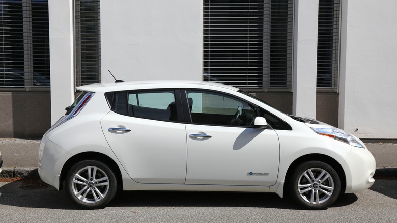 white 2019 Nissan Leaf parked roadside